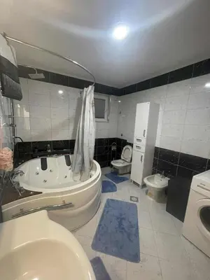 a bathroom with a tub and a toilet and a sink at Zanesovici Jezero in Bugojno