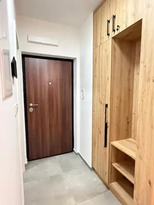 a door in a room with a wooden door at CENTRAL SQUARE Tuzla in Tuzla