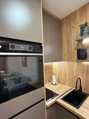 a kitchen with an oven and a sink at CENTRAL SQUARE Tuzla in Tuzla
