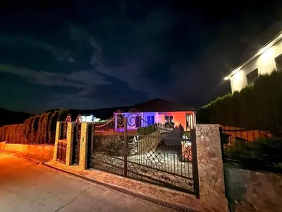 a gate in front of a house at night at Villa Leah in Bihać