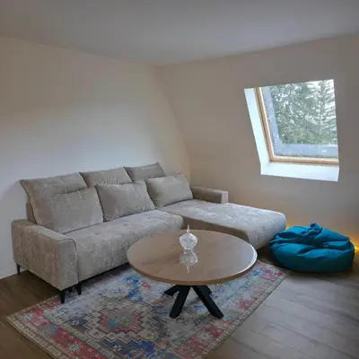a living room with a couch and a table at MaLi Raj in Vlasic