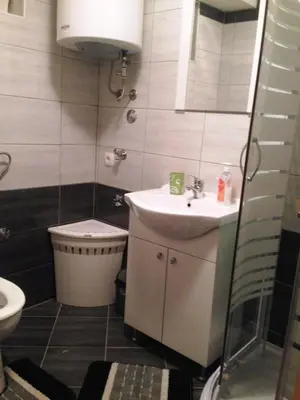 a small bathroom with a sink and a toilet at Kuća za odmor Vukas in Kupres