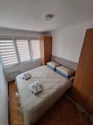 a bedroom with a bed with two pillows on it at Apartman Mila in Bihać