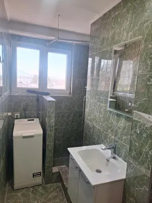 a bathroom with a sink and a mirror at Apartman Mila in Bihać