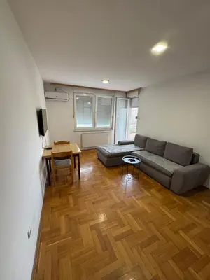 a living room with a couch and a table at Jedinica in Banja Luka
