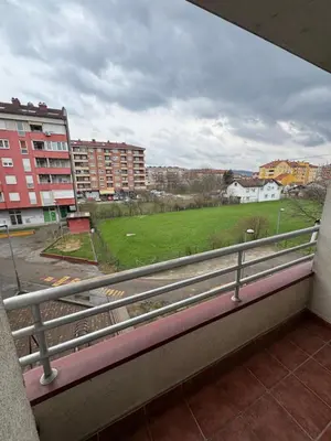 a balcony with a view of a field and buildings at Jedinica in Banja Luka