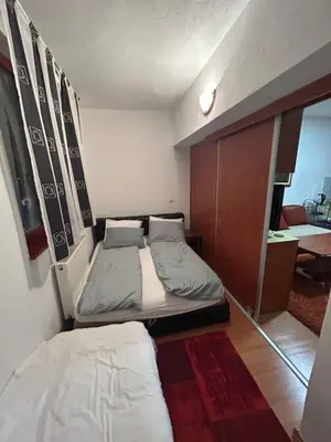 a small bedroom with two beds in a room at Vlašić Forest Valley in Vlasic