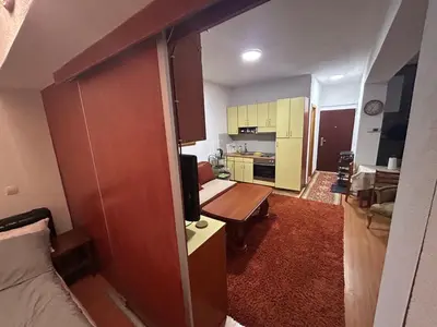 a small room with a kitchen and a living room at Vlašić Forest Valley in Vlasic