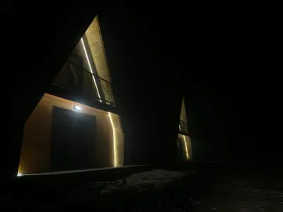 an empty building with a door in the dark at Cottage Soul Rest