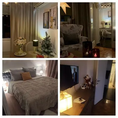 a room with a bed and a christmas tree in it at City Center Apartment in Banja Luka