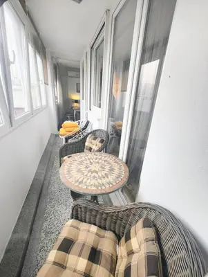 a room with chairs and a table and a couch at City Center Apartment in Banja Luka