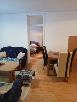 a living room with a couch and chairs and a table at Apartment Snow Vlašić in Šišava
