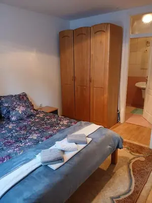 a bedroom with a bed with towels on it at Apartment Snow Vlašić in Šišava