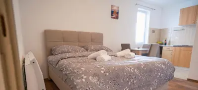 a bedroom with a bed with two towels on it at Biser Kupresa 2 in Kupres