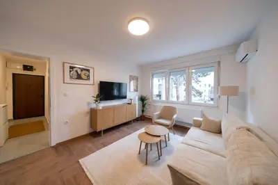 a living room with a couch and a table at Apartman Srna in Banja Luka
