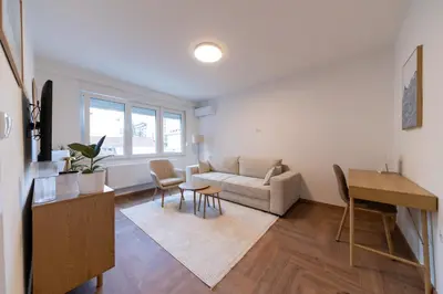 a living room with a couch and a table at Apartman Srna in Banja Luka