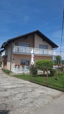 a house with a fence in front of it at Apartman - TAHRIC in Bihać