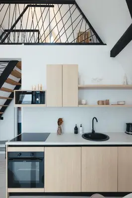 a kitchen with a sink and a stove at De Villa Bey in Kupres