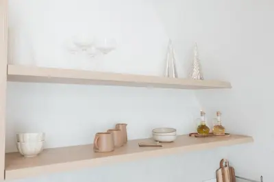 a shelf with wine glasses and other items on it at De Villa Bey in Kupres