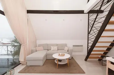 a living room with a couch and a table at De Villa Bey in Kupres