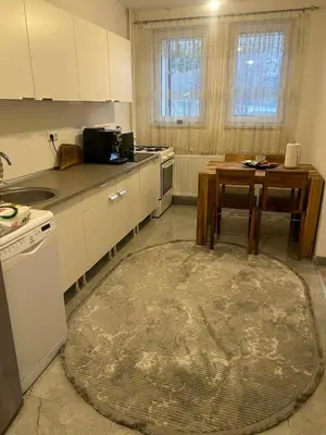 a kitchen with a table and a table sidx sidx sidx sidx at Stan Krndija - Tesanj in Tešanj
