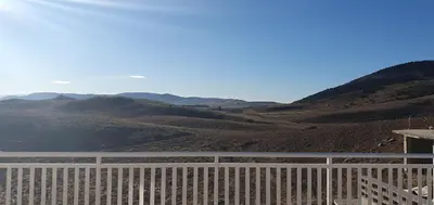 a view of the mountains from a fence at Vikendica Jadranka in Kupres
