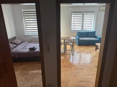 a room with a bed and a table and a couch at dvojka in Banja Luka