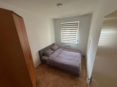 a small bedroom with a bed and a window at dvojka in Banja Luka