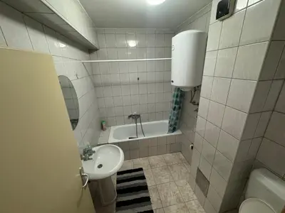 a bathroom with a sink and a toilet and a tub at dvojka in Banja Luka