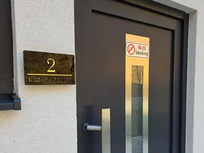 a door with a no smoking sign on it at Kozara Resort