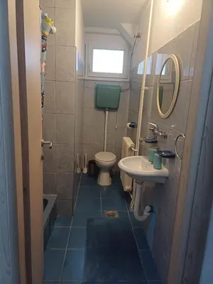 a small bathroom with a toilet and a sink at Welcome Apartment in Banja Luka