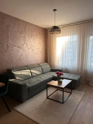 a living room with a couch and a table at Apartman Green Park in Banja Luka