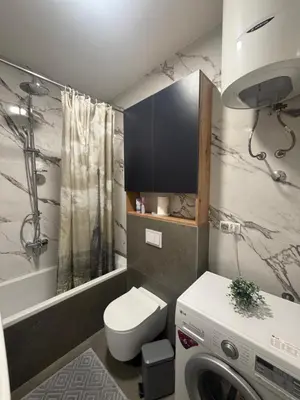 a small bathroom with a toilet and a sink at Apartman Green Park in Banja Luka