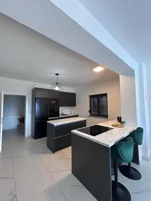 a large kitchen with a island in a room at Villa Sky in Bosanska Krupa