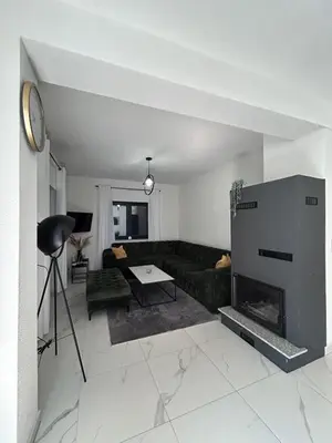 a living room with a couch and a fireplace at Villa Sky in Bosanska Krupa