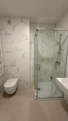 a bathroom with a shower and a toilet and a sink at Stela Stan Na Dan Banja Luka in Banja Luka