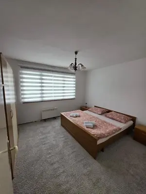 a bedroom with two beds and a window at Apartman Daki in Vareš