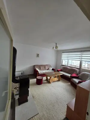 a living room with couches and a coffee table at Apartman Daki in Vareš