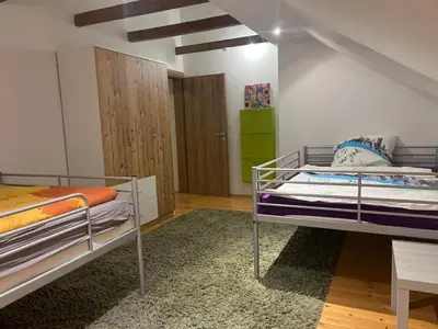 a bedroom with two bunk beds and a closet at House in Kreševo - Mountain view - in Kreševo