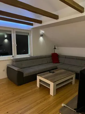 a living room with a couch and a coffee table at House in Kreševo - Mountain view - in Kreševo