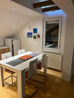 a white dining room table with chairs and a window at House in Kreševo - Mountain view - in Kreševo