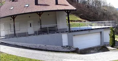 a house with two garage doors and a driveway at House in Kreševo - Mountain view - in Kreševo