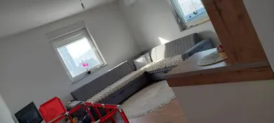 a living room with couches at Delta in Lukavac