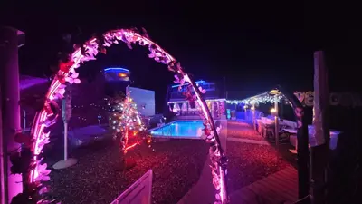 a group of lights around a swimming pool at night at Neno Pyramid Wellness Retreat in Visoko