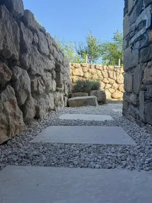 a stone wall next to a stone path at Casa Elena in Banja Luka