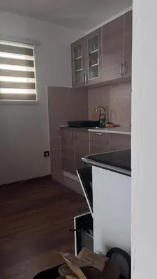 a kitchen with a sink and a counter top at Holiday House M&M Kupres in Kupres