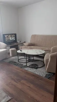 a living room with a couch and a coffee table at Holiday House M&M Kupres in Kupres