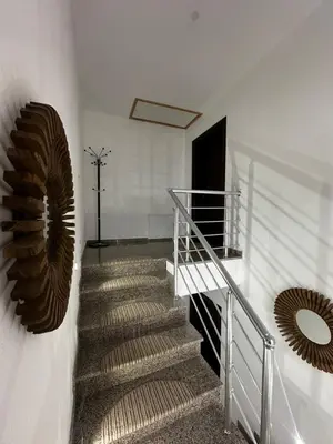 a staircase with a metal railing and a spiral stair case at Apartment Vlasic in Šišava