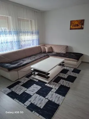 a living room with a couch and a coffee table at Avenue in Bosanska Krupa