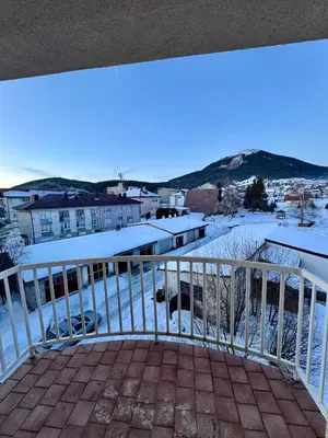a view from the balcony of a house with snow at Apartman Zimski Kutak in Kupres